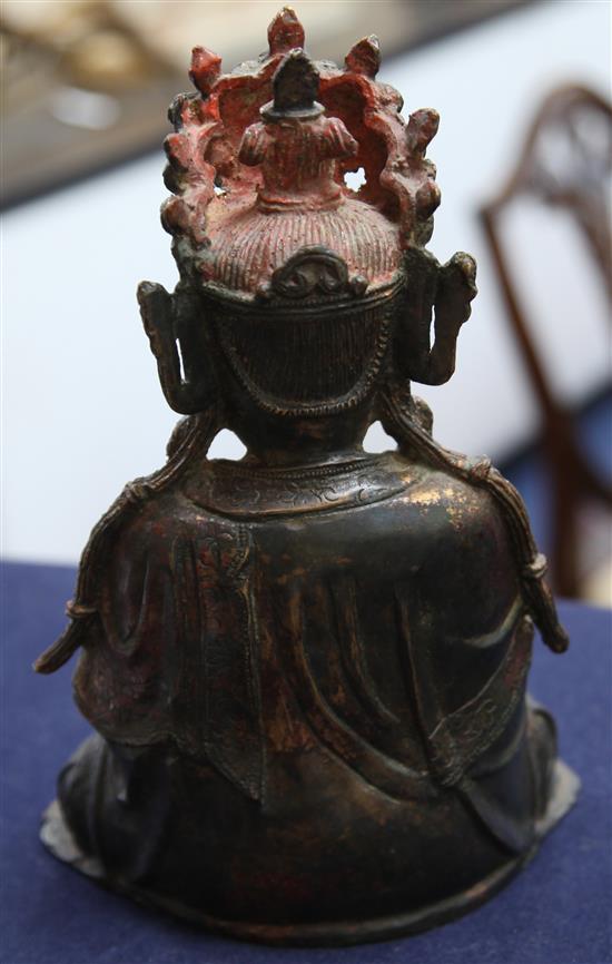 A Chinese lacquered bronze seated figure of Guanyin, possibly Ming dynasty, height 31cm